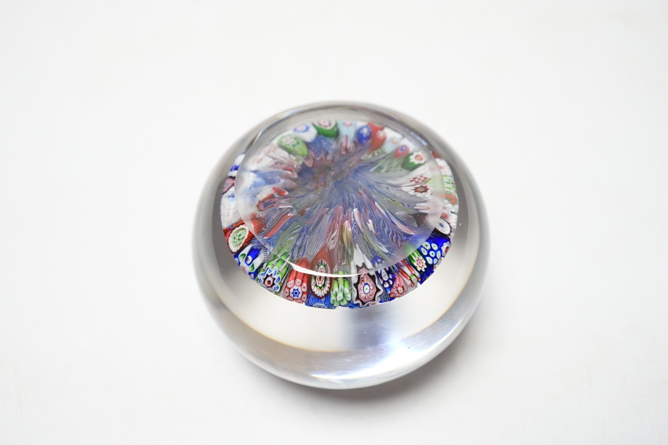 A Baccarat close packed millefiori paperweight with two rose corner, 7cm diameter